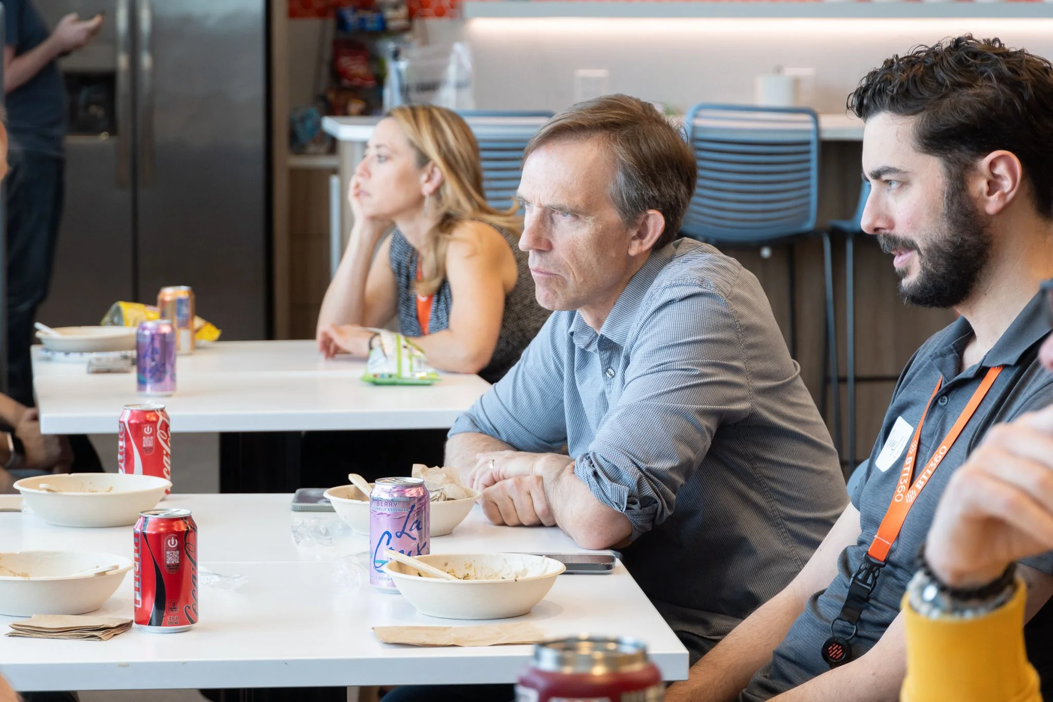 Paul sitting alongside team members during a working session